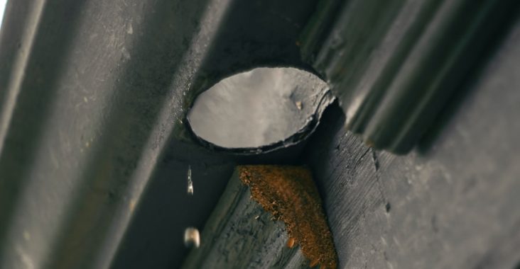 a close up of a metal object on a building