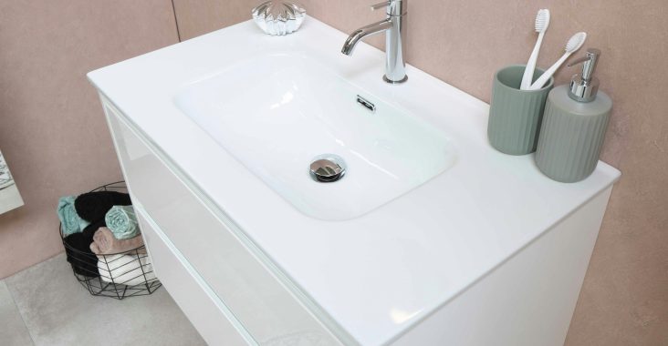 white ceramic sink with stainless steel faucet